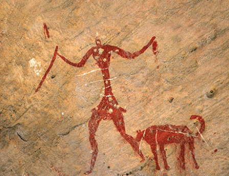 Наскельний малюнок мисливця і собаки, виконаний у період між 5000 та 2000 роками до нашої ери.&amp;nbsp;JOE &amp;amp; CLAIR CARNEGIE, LIBYAN SOUP / GETTY IMAGES