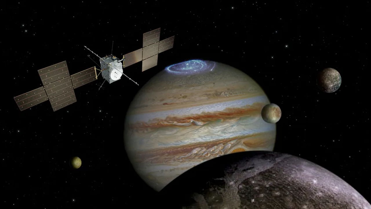 Художнє зображення JUICE поруч з Юпітером і його супутниками. ESA