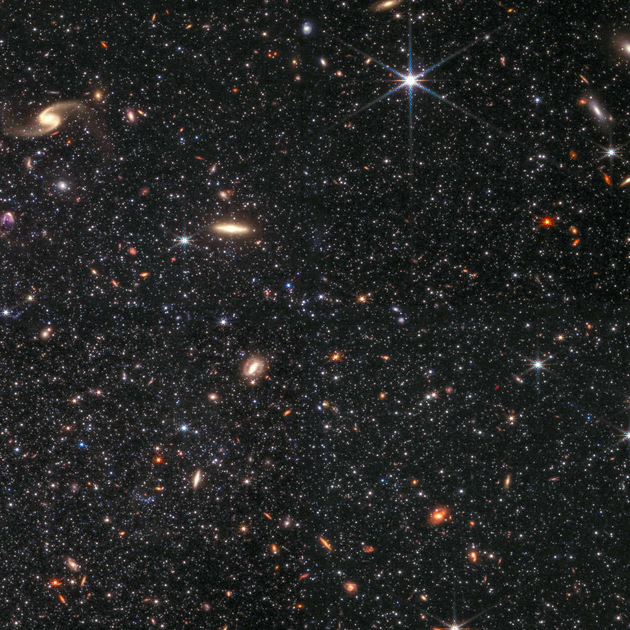 Цей знімок частини галактики WLM отримали в інфрачервоному діапазоні за допомогою камери NIRCam. Синім кольором зображено світло на довжині хвилі 0,9 мікрометра, блакитним — 1,5 мікрометра, а жовтим та червоним — 2,5 та 3,4 мікрометра відповідно. Цей знімок добре демонструє, як телескоп може розрізняти навіть дуже тьмяні зорі. NASA, ESA, CSA, Kristen McQuinn (RU); Zolt G. Levay (STScI)